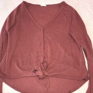 A mauve waffle knit lightweight sweater